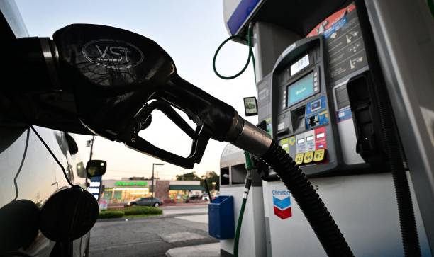 A nozzle pumps gasoline into a vehicle at a gas station in Los Angeles, California on October 5, 2022. - Saudi Arabia, Russia and other top oil producers agreed on a major cut in production on Wednesday to boost crude prices -- a move denounced by the United States as a concession to Moscow that will further hurt the global economy. US gas prices have already been trending higher in recent weeks and California gas prices are approaching record highs again. (Photo by Frederic J. BROWN / AFP) (Photo by FREDERIC J. BROWN/AFP via Getty Images)